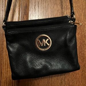 Black Michael Kors crossbody purse.